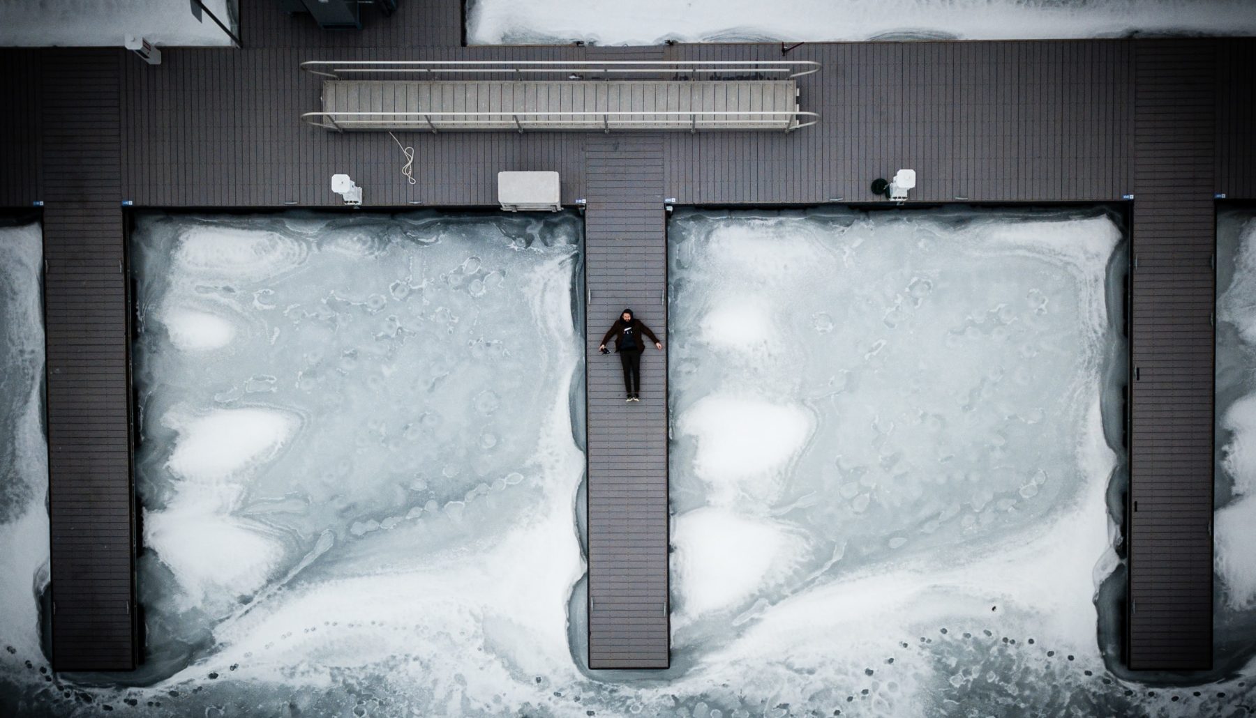 Career stages illustrated by a man lying between pools of ice