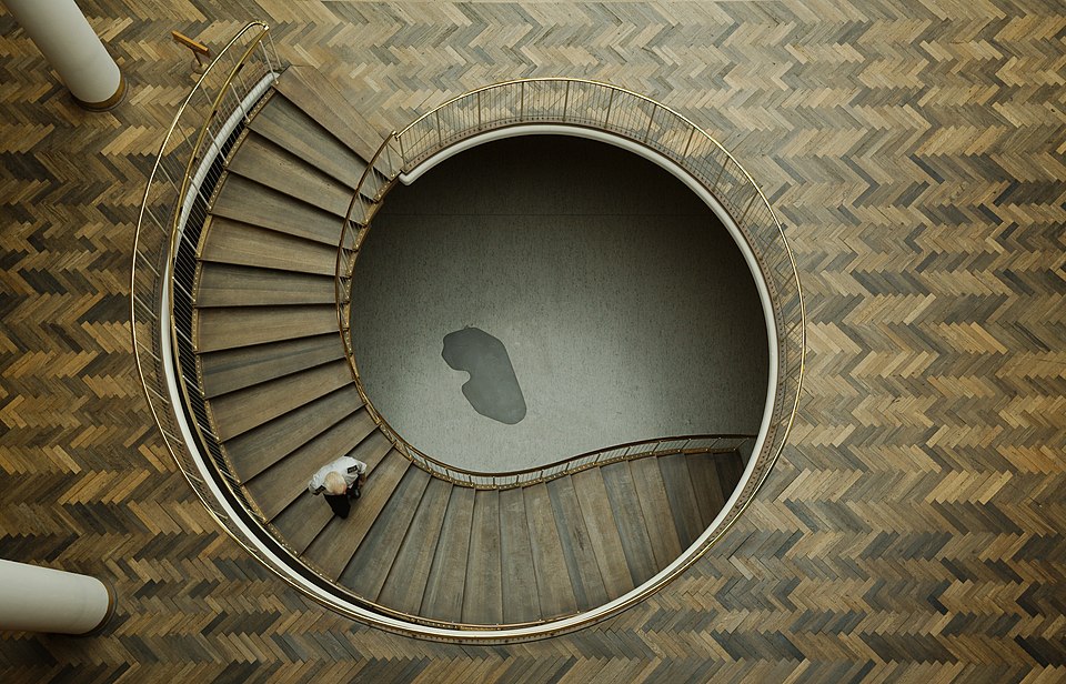 A curving stairway leads underground